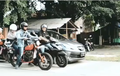Naik Motor Sambil Dengerin Musik Bisa Ditilang? Gini Kata Polisi...