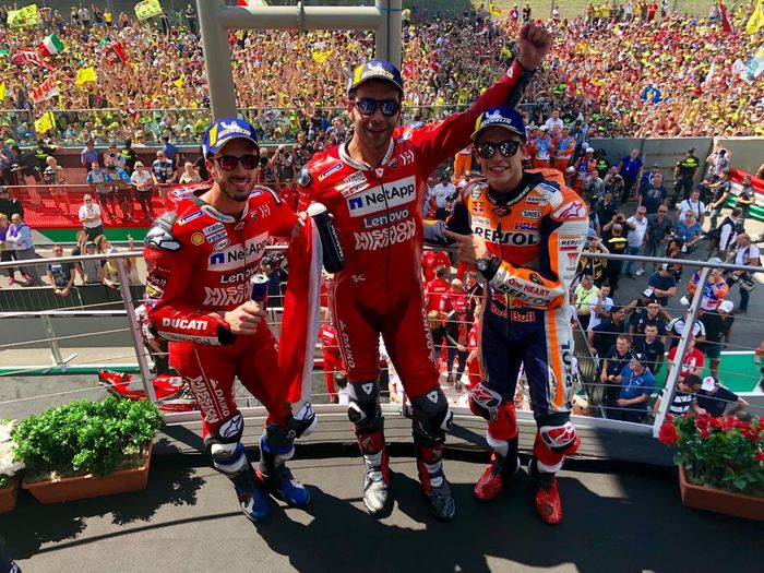 Marc Marquez dan Andrea Dovizioso mengapit Danilo Petrucci ketika memenangkan MotoGP Italia 2019