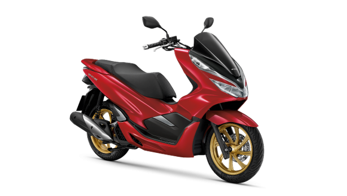 Honda PCX 150 Thailand berwarna merah dan pelek emas.