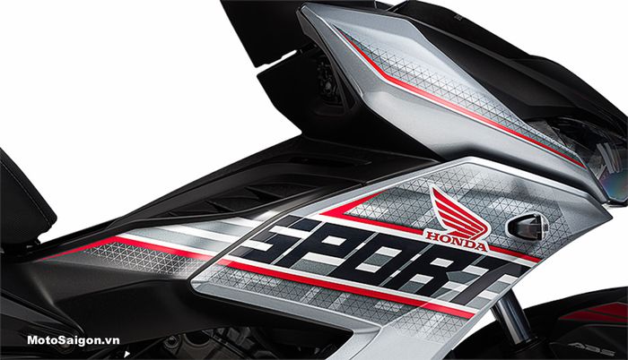 Beberapa garis merah serta motif segitiga pada Honda Winner X ABS Sport