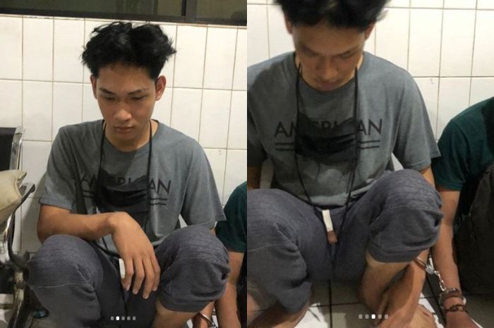 Youtuber Ferdian Paleka terlihat diam tertunduk saat digelandang ke kantor polisi 