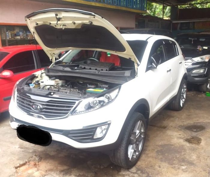 KIA Sportage Gen 3 tengah servis di bengkel Garasi 30