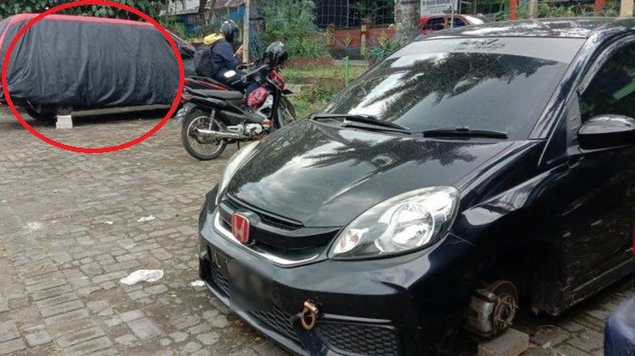 Dari kejauhan tampak roda Toyota Kijang LGX dan Brio dimaling saat parkir