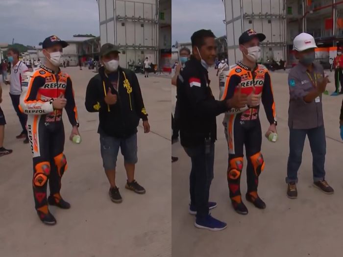 Pol Espargaro kayak lagi jaga protokol kesehatan banget tuh pas foto bareng fans-nya.