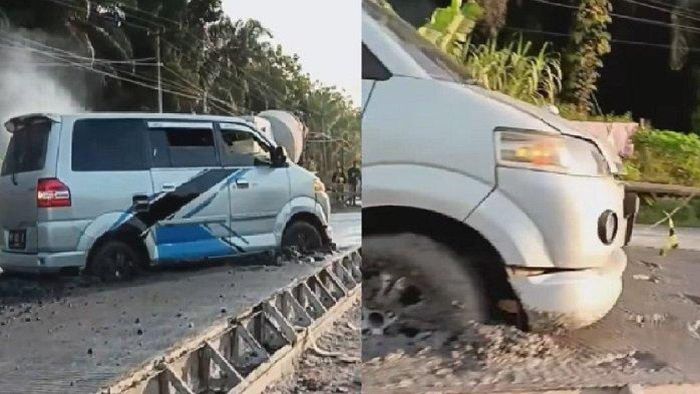 Suzuki APV nekat lewati cor-coran beton jalan raya masih basah hingga akhirnya tersangkut