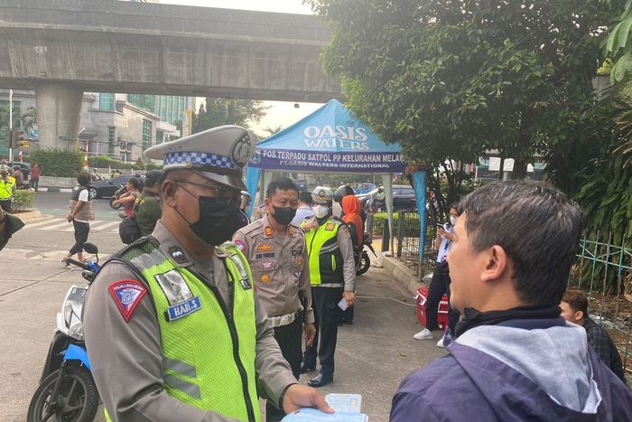 Dody, pemotor Yamaha NMAX yang kena tilang uji emisi gara-gara modifikasi motor di bagian knalpot.