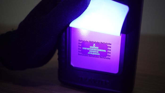 Invisible ink juga disematkan di label kedua