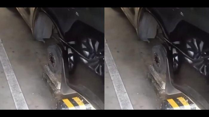 Terlihat roda kiri belakang Toyota Kijang Innova Reborn yang parkir di Bandara I Gusti Ngurah Rai, Bali hilang dicuri sisakan tromol yang diganjal batako
