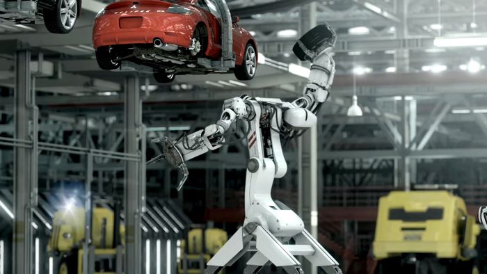 Ilustrasi pabrik yang menggunakan robot untuk merakit mobil