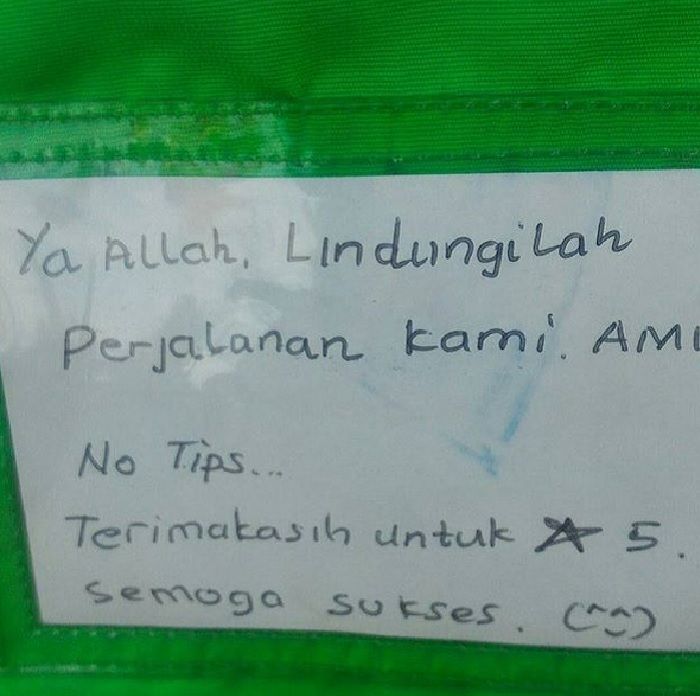 Pesan rohani di tulisan jaket driver ojol