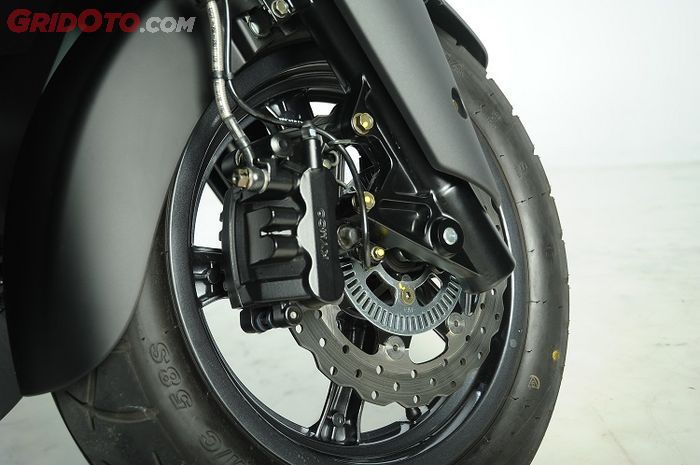 Ilustrasi rem cakram depan sepeda motor dengan fitur rem ABS