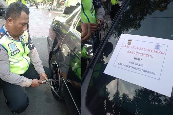 Petugas Satlantas Polres Tabanan menggembok ban mobil yang melanggar di Jalan Diponegoro, Tabanan, Senin (24/6/2019). 