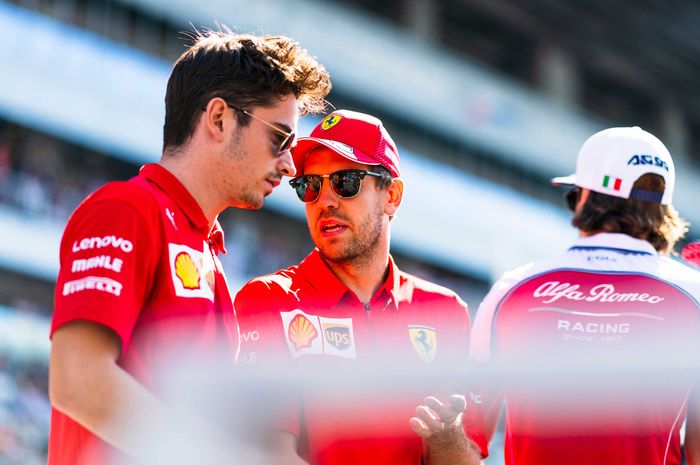 Charles Leclerc (kiri) dan Sebastian Vettel di F1 Rusia 2019