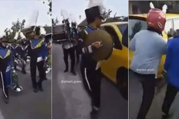 Sebuah Honda Jazz tampak sedang menyeruduk rombongan Marching Band di tengah acara karnaval