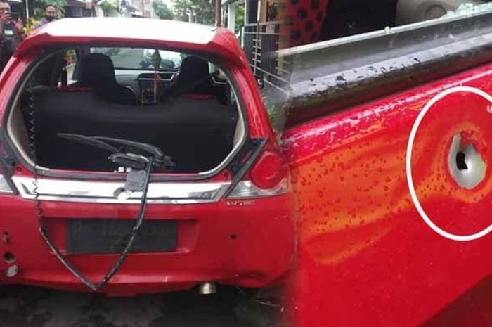 Honda Brio yang ditinggal seorang wanita di Perumahan Kodim, desa Jubung, Sukorambi, Jember dengan kondisi hancur dan ada lubang bekas tembakan