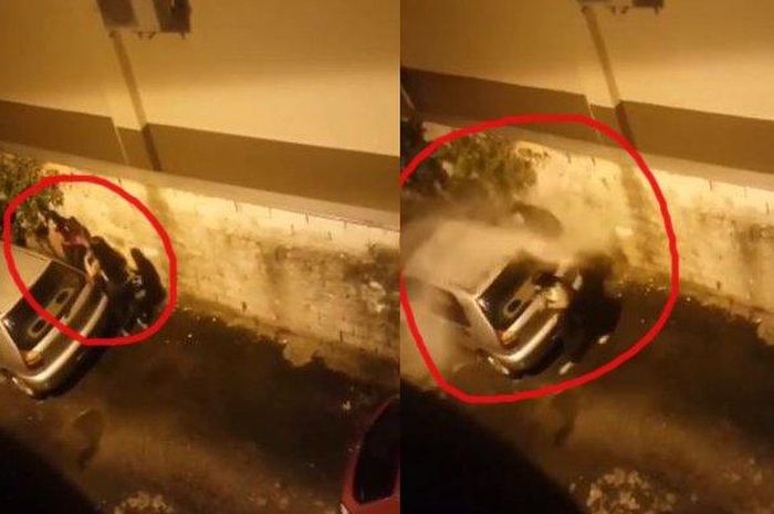 Tangkapan layar video wanita hendak buang air kecil di balik mobil yang sedang terparkir di jalan gang, namun mendapat kejutan disiram air dari lantai atas bangunan di sisi gang.  
