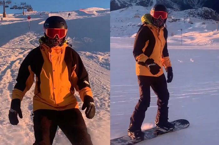 Valentino Rossi dengan gear lengkap ketika sedang snowboarding di Italia.