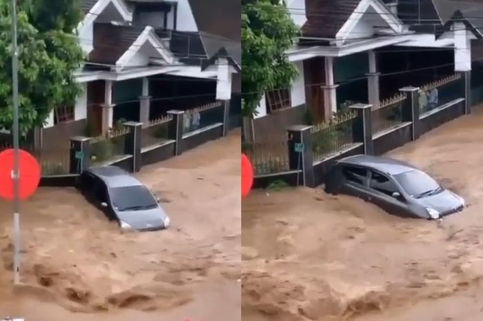 Daihatsu Ayla yang terseret arus banjir di Perumahan BMP, Jember pada Minggu (09/01/2022).