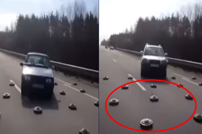 Tangkap layar video detik-detik mobil lewati kepungan ranjau yang disebar di jalan raya di Ukraina. 