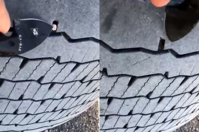 Kegabutan sopir truk yang berusaha mencongkel kerikil dari ban.