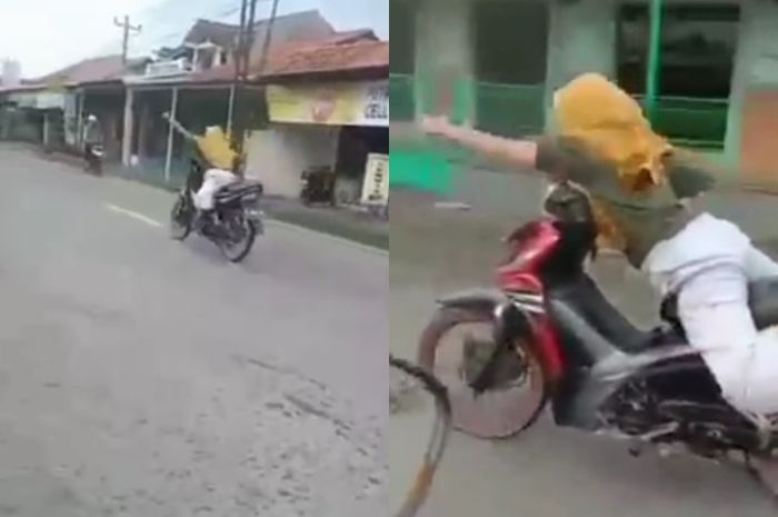 Viral video emak-emak naik Honda Revo, beraksi bak superman di jalan raya.