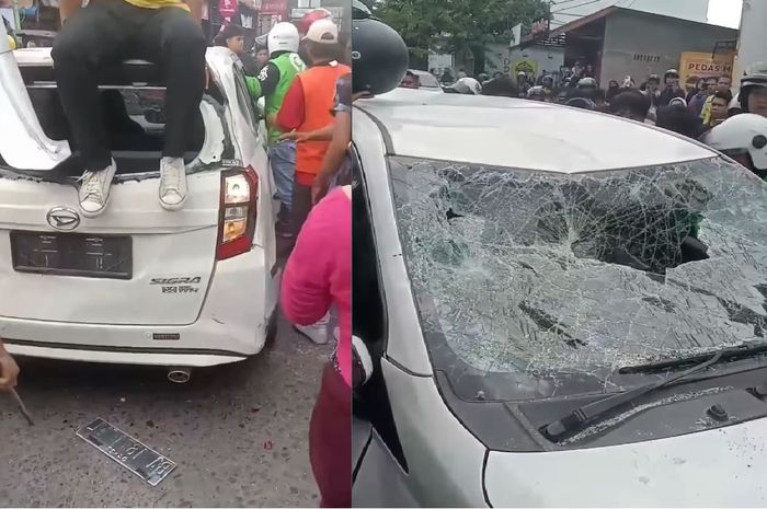 Massa menghancurkan Daihatsu Sigra beserta pengemudinya karena teriakan ngaco dari seorang pemotor di Jl Sisingamangaraja, kota Medan, Sumatera Utara