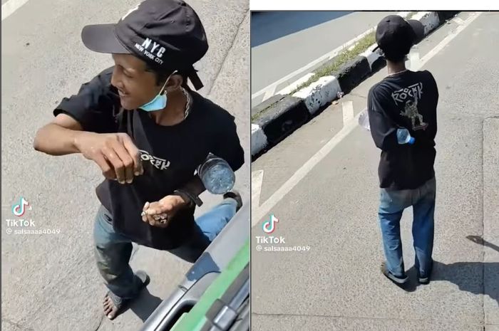 Pak Ogah yang menjual air mineral secara paksa ke para sopir truk di simpang lima Semper, Koja, Jakarta Utara