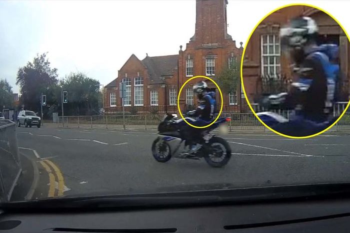 PIC FROM MERCURY PRESS (PICTURED: THE MOTORCYCLIST SEEN TEXTING WHILE RIDING HIS BIKE IN KETTERING, 