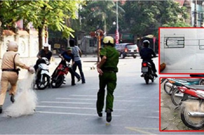 Polisi Vietnam menggunakan jala untuk menangkap pebalap liar.