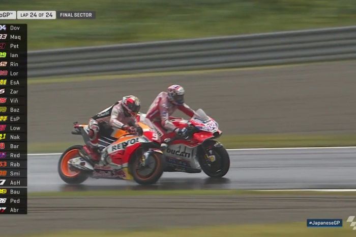 Andrea Dovizioso dan Marc Marquez saling serang di sirkuit Motegi Jepang