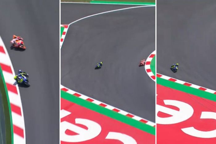 Pebalap Movistar Yamaha Valentino Rossi (biru) melebar saat diikuti oleh rivalnya, Marc Marquez, dalam kualifikasi MotoGP Catalunya di Sirkuit Catalunya