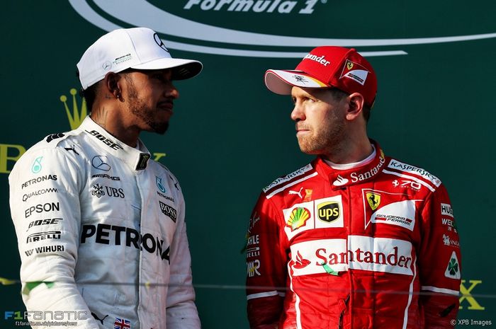 Lewis Hamilton (GBR) Mercedes AMG F1 and Sebastian Vettel (GER) Ferrari on the podium