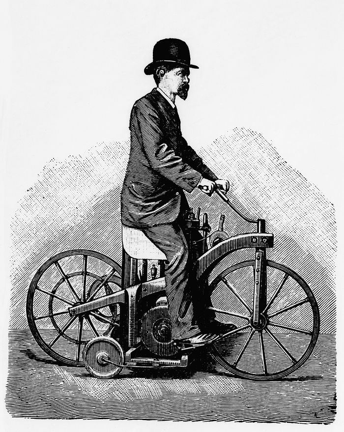 Wilhelm Maybach (9. Februar 1846 bis 29. Dezember 1929). Darstellung auf dem im Jahr 1885 von Gottlieb Daimler zum Patent angemeldeten Reitwagen. Dieses erste Motorrad der Welt dient als Versuchstr&auml;ger f&uuml;r den schnell laufenden Viertaktmotor, den Daimler und Maybach erfunden haben. (Fotosignatur der Mercedes-Benz Classic Archive: B31358)   Wilhelm Maybach (9 February 1846 to 29 December 1929). Shown on the Reitwagen (&ldquo;riding car&rdquo;), which Gottlieb Daimler registered as a patent in 1885. This vehicle, the world&rsquo;s first motorcycle, was a test vehicle for the fast-running four-stroke engine that Daimler and Maybach had invented. (Photo signature in the Mercedes-Benz Classic archive: B31358) 