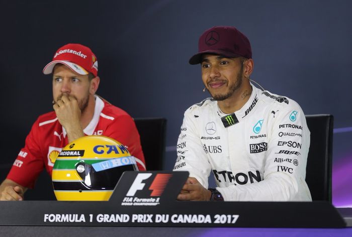 Sebastian Vettel dan Lewis Hamilton kini sama-sama menyandang gelar juara dunia empat kali