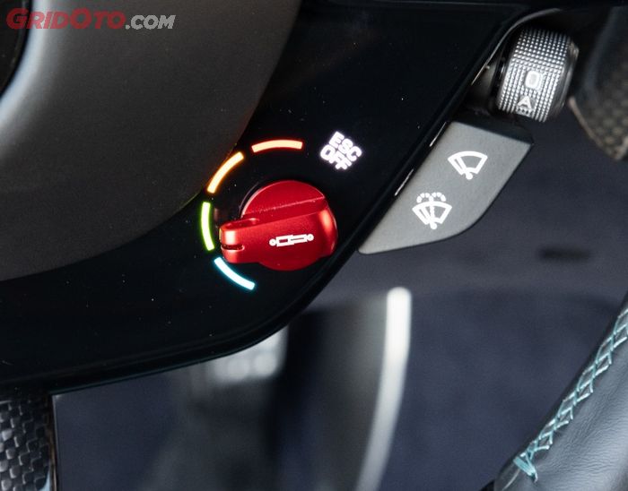 Kenop mode berkendara di lingkar kemudi