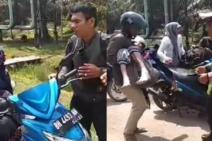 Polisi membantu pengendara motor yang ternyata sedag mengangkut jenazah