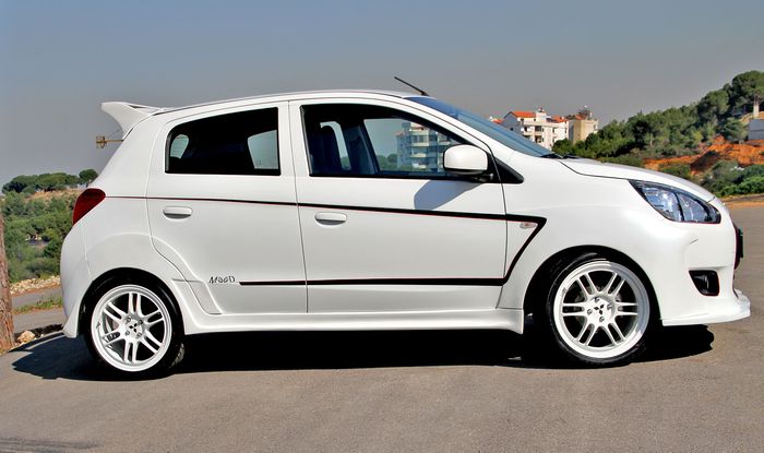 Modifikasi Mitsubishi Mirage pasang pelek model palang ganda