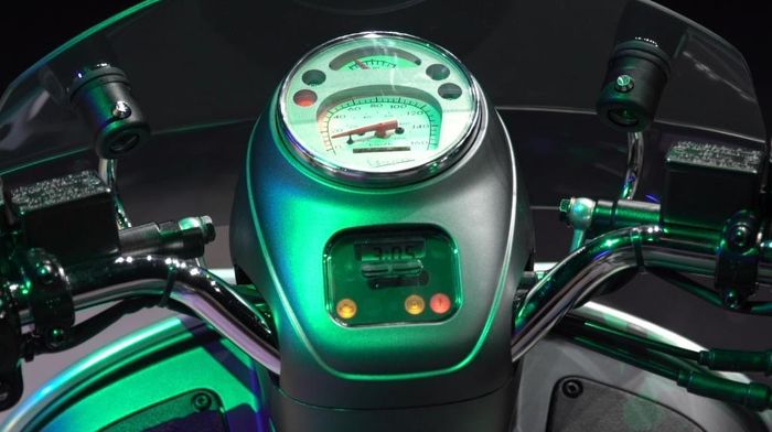 Spidometer analog background putih dipadukan dengan handlebar pipa kental nuansa klasik