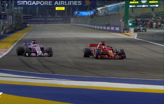 Sebastian Vettel melewati Sergio Perez, kecepatannya tertahan pembalap Force India ini