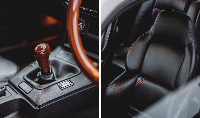 Kabin BMW E36 di lapis dengan kulit warna hitam dan aksen kayu