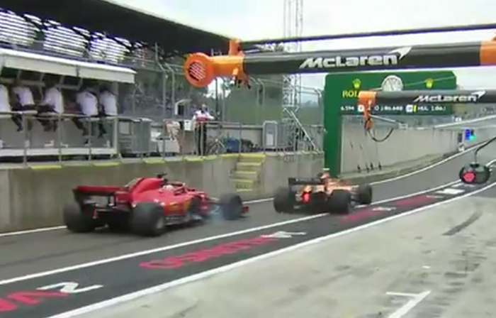 Sebastian Vettel harus mengerem mendadak untuk menghindari tabrakan dengan Stoffel Vandoorne yang tida-tiba keluar dari garasi pit tim McLaren