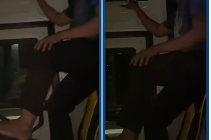 Sopir bus yang menyetir menggunakan kaki sambil berdiri di atas jok.