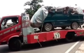 Modus Siasati Larangan Mudik, Truk Towing Angkut Mobil Ditutupi Terpal, Isinya Seludupkan Para Pemudik