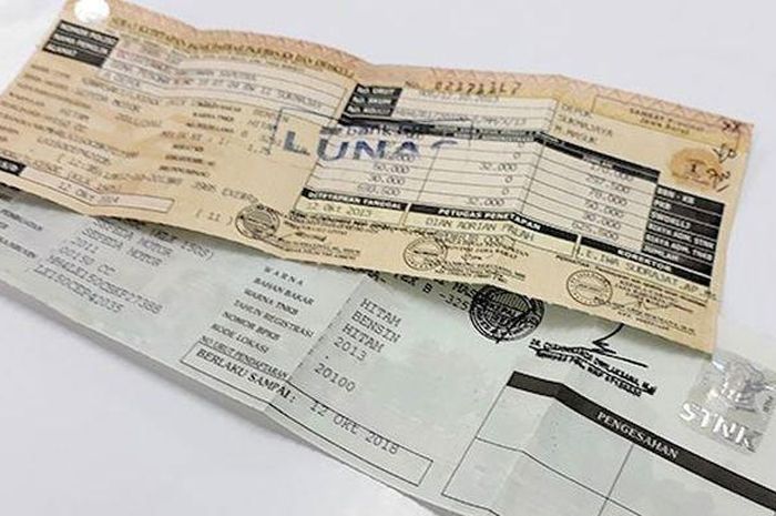 STNK kendaraan surat sebelah.